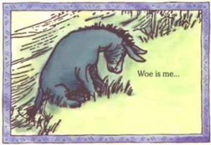 Eeyore, the always-pessimistic plush toy donkey from A.A. Milne’s cast of characters featured in his Winnie-the-Pooh children’s stories.