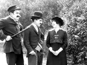 Charlie Chaplin in "Getting Acquainted," with Mabel Norman